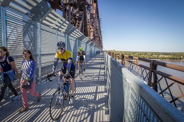 Bikers going across Big River Crossing  Big River Crossing.png