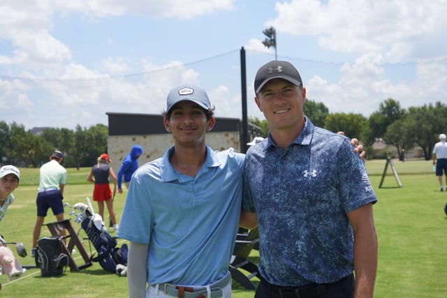 Jordan Spieth picture with another kid on the range with a blue shirt-2024- Under Armour Jordan Speith Championship.jpeg