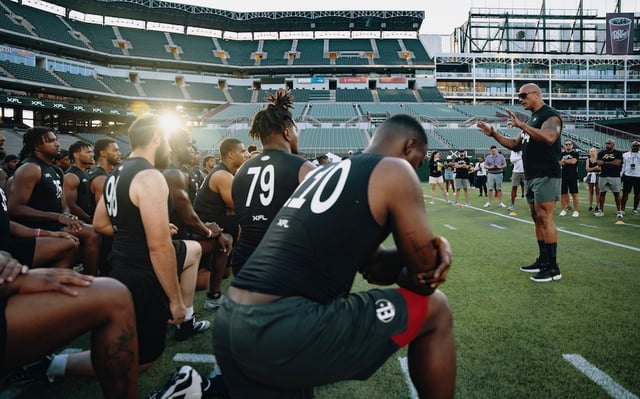 Dwayne-Johnson-talking-to-players-at-XFL-showcase-at-Choctaw-Stadium-970-deep-credit-.jpeg